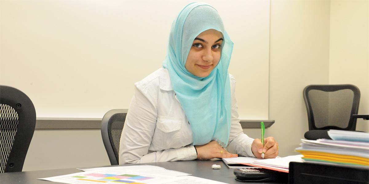 Muslim American student studying